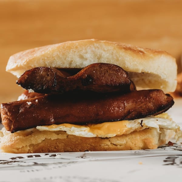 Lou Ann's Biscuits & Burgers' breakfast sandwich with sausage, egg, and cheese on a biscuit.